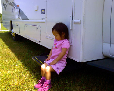 3rd stop was our Great Aunt's. After we got there, Baby 1 wanted to come with me to get something from the RV.  She beat me there and waited patiently in the shade on the side step.
